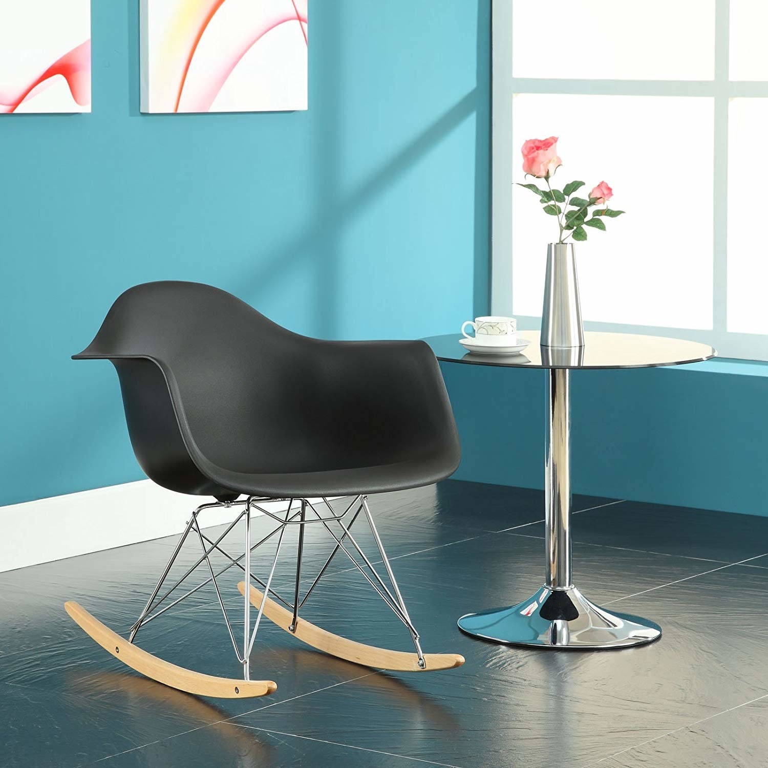 A wide black arm chair with rocker legs