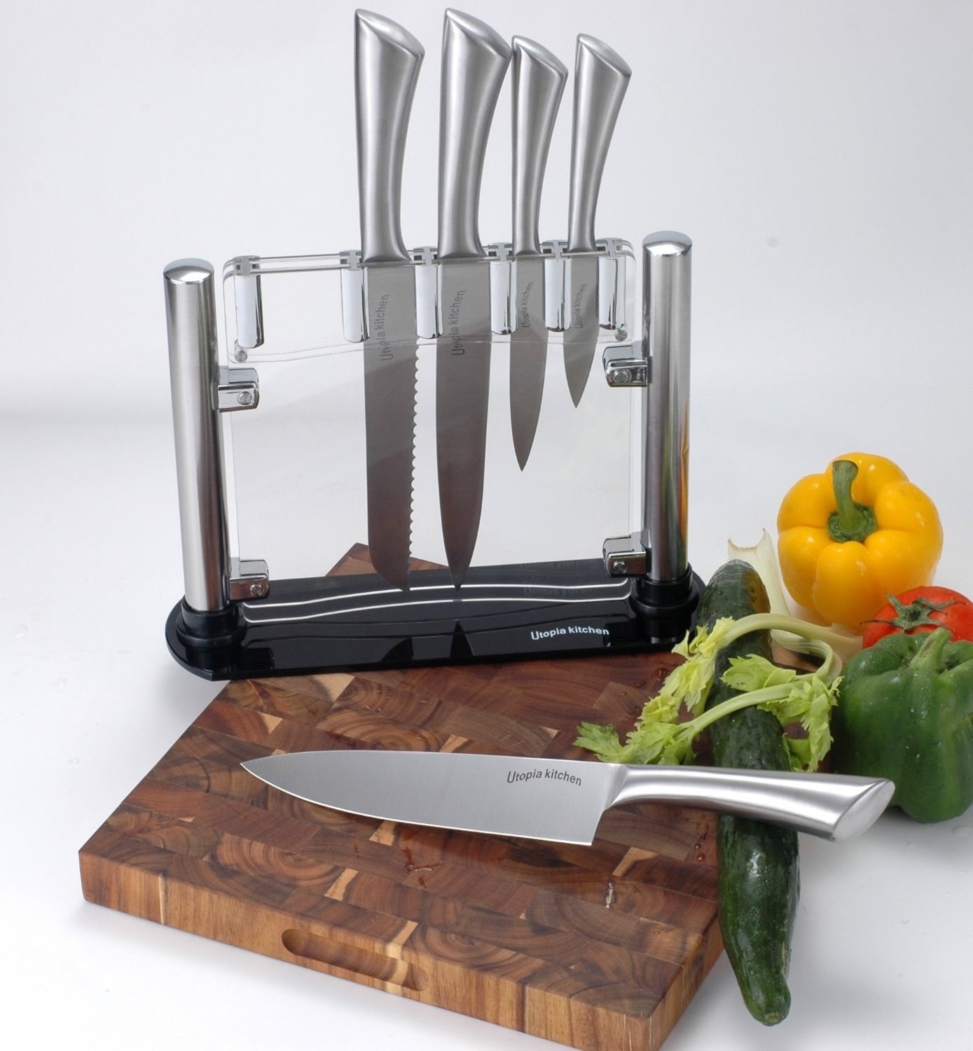 Clear knife block with five silver knives 