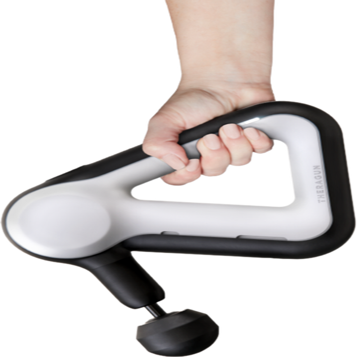 person holding the theragun