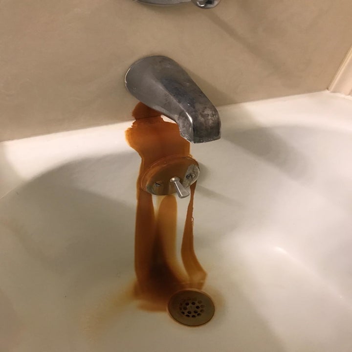 dark rust stain on tub