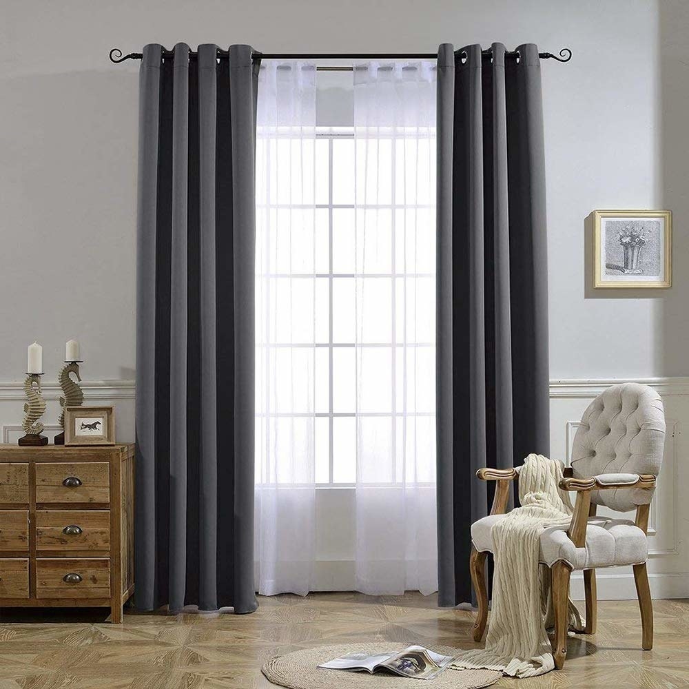 the blackout curtains in gray over a window 
