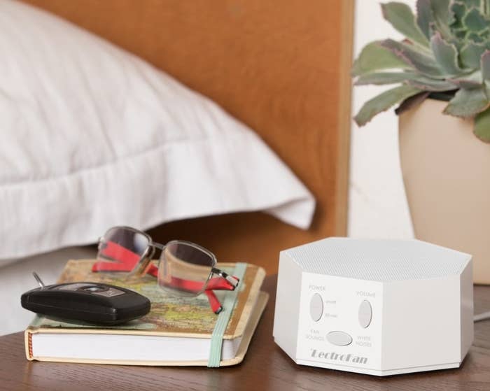 White noise machine on bedside table 