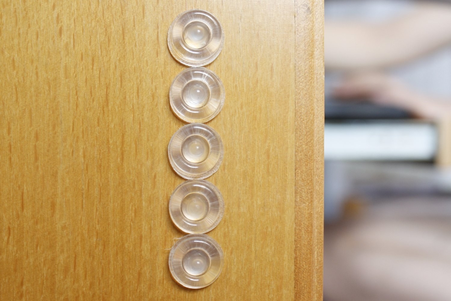 the clear sound dampeners on the inside of a cabinet 