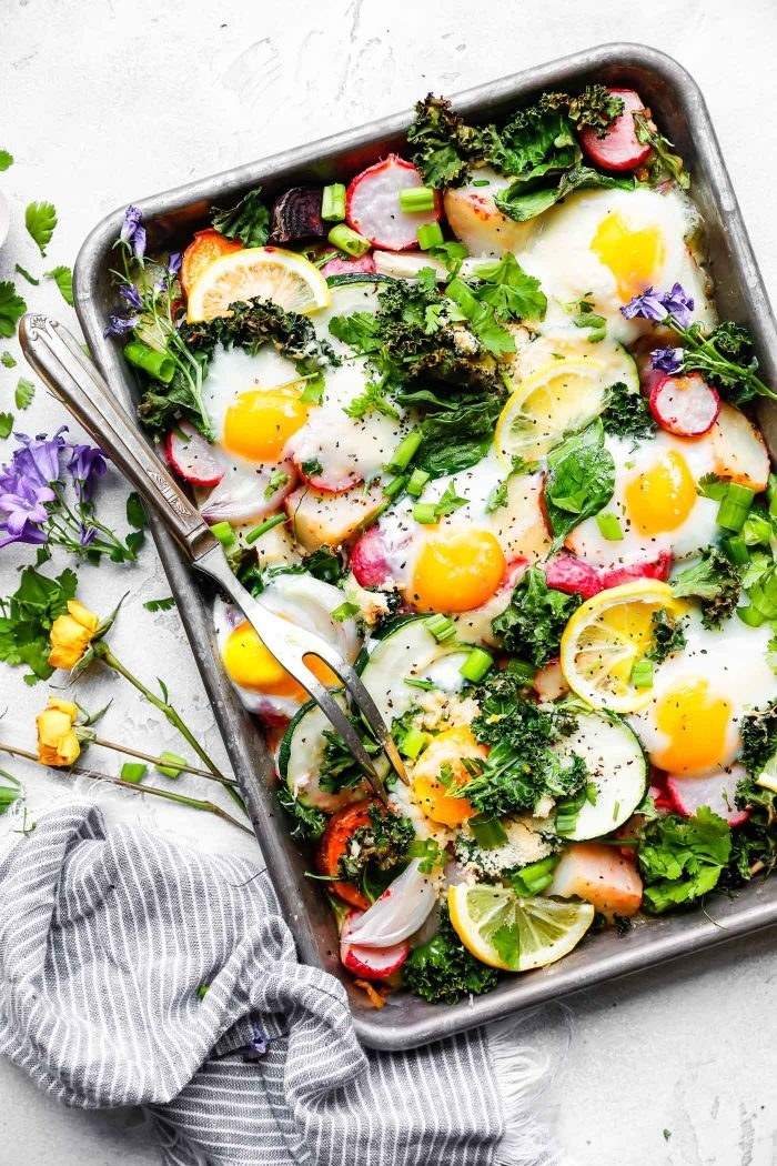 Baked Eggs With Roasted Vegetables in a baking pan