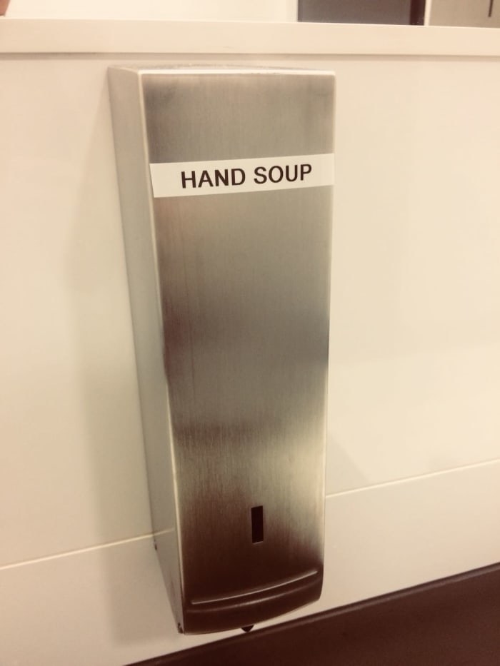 Soap dispenser labeled &quot;hand soup&quot;