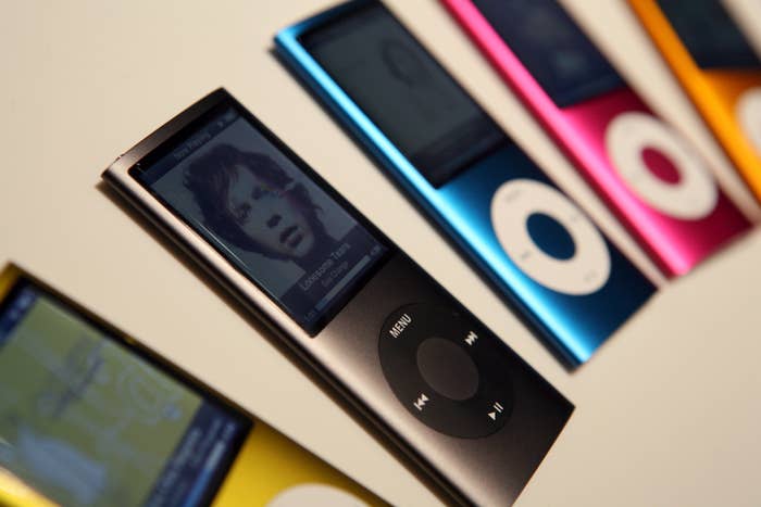 A photo of a collection of color iPod Nanos laid on a white table top.