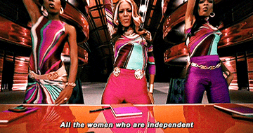 A GIF of Destiny&#x27;s Child standing up singing &quot;All the women who are independent&quot; taken from their music video for &quot;Independent Women, Part 1&quot;
