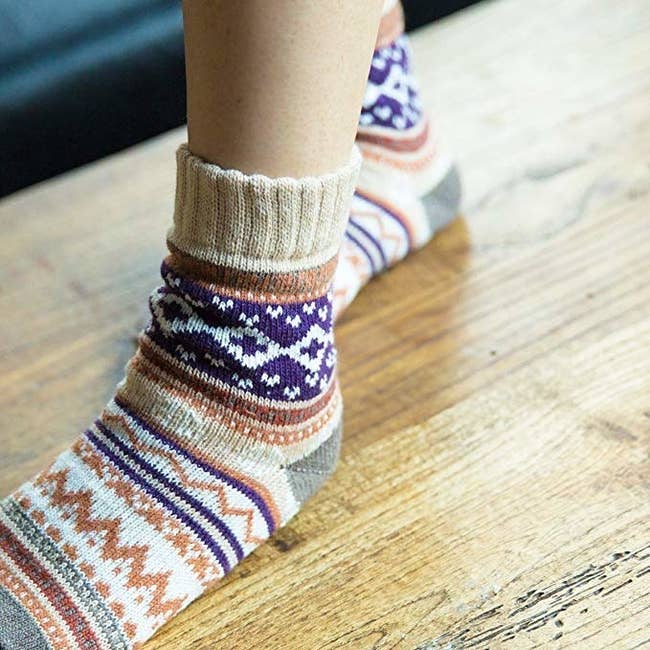 person wearing colorful argyle print socks