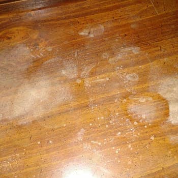 wooden table with white splotch stains
