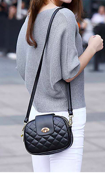 model wearing quilted black crossbody bag