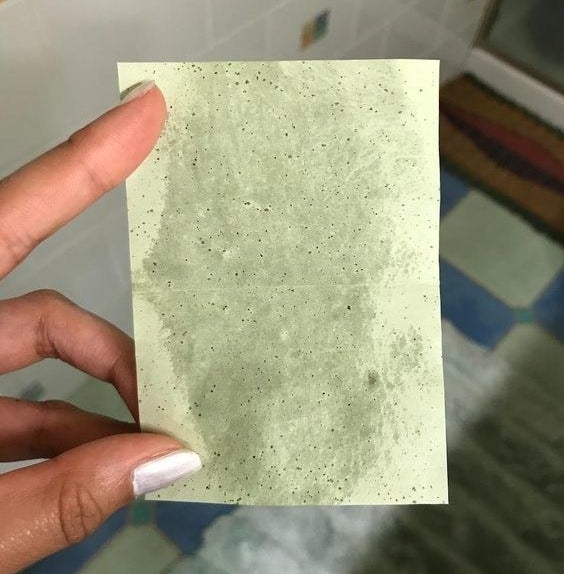 Reviewer showing oil on sheet