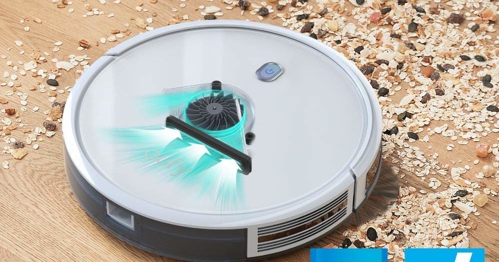 the robot vacuum cleaning up a mess on the floor