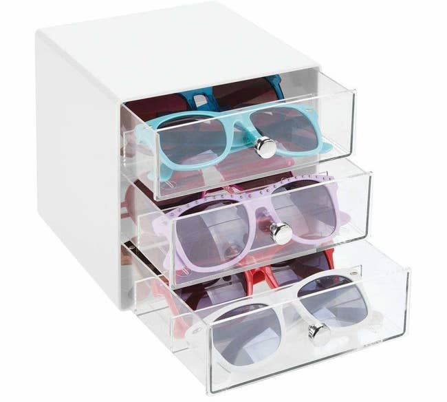 organizer with clear drawers containing glasses