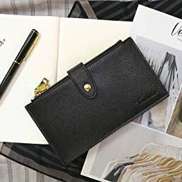 The black wallet with gold hardware closed compactly 