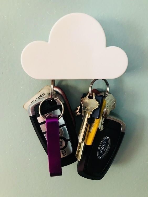 cloud key holder holds car keys 