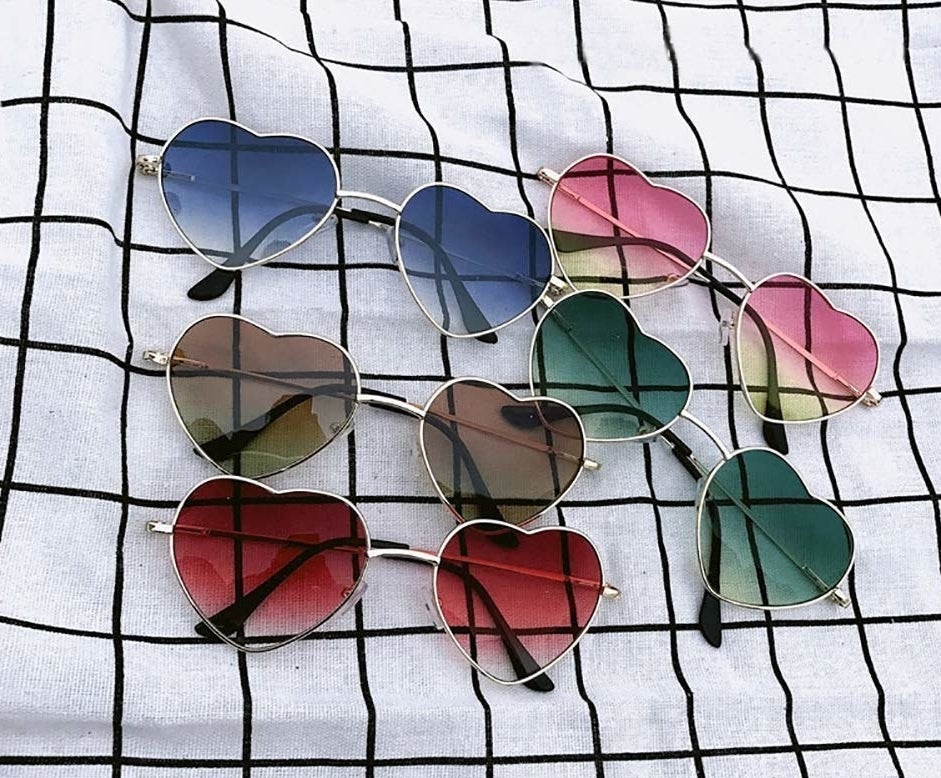array of heart shaped sunglasses in various colors 