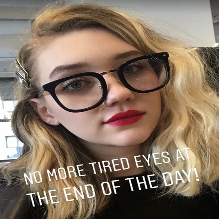 BuzzFeed editor Maitland wearing the black glasses with clear lenses. The photo says, "No more tired eyes at the end of the day."