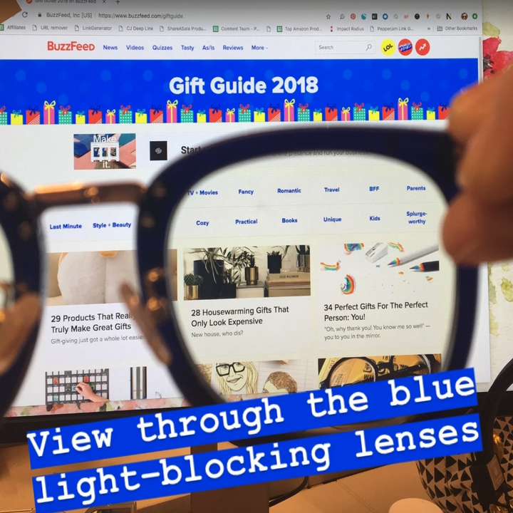 close-up of the lens as it's facing a laptop. The screen looks less bright and stark as opposed to the part of the screen that isn't shown through the lens.