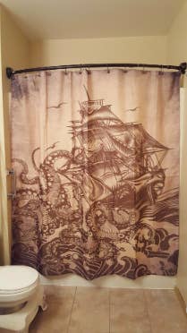 shower curtain with an old timey nautical scene of Kraken taking over a ship 