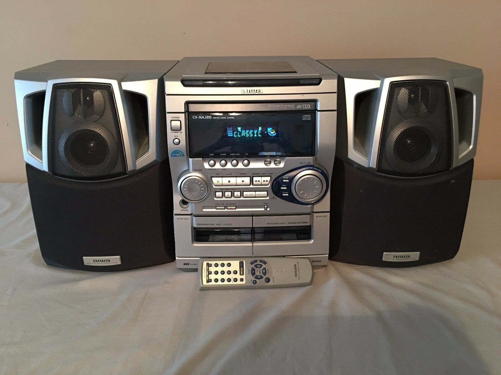 A silver 3-CD player boombox from the late &#x27;90s