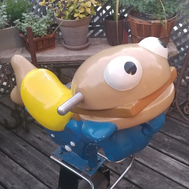  A photo of a cartoon looking Filet-O-Fish spring rider