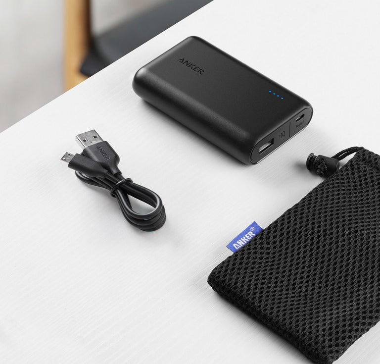 small black rectangular charger, usb cord, and pouch