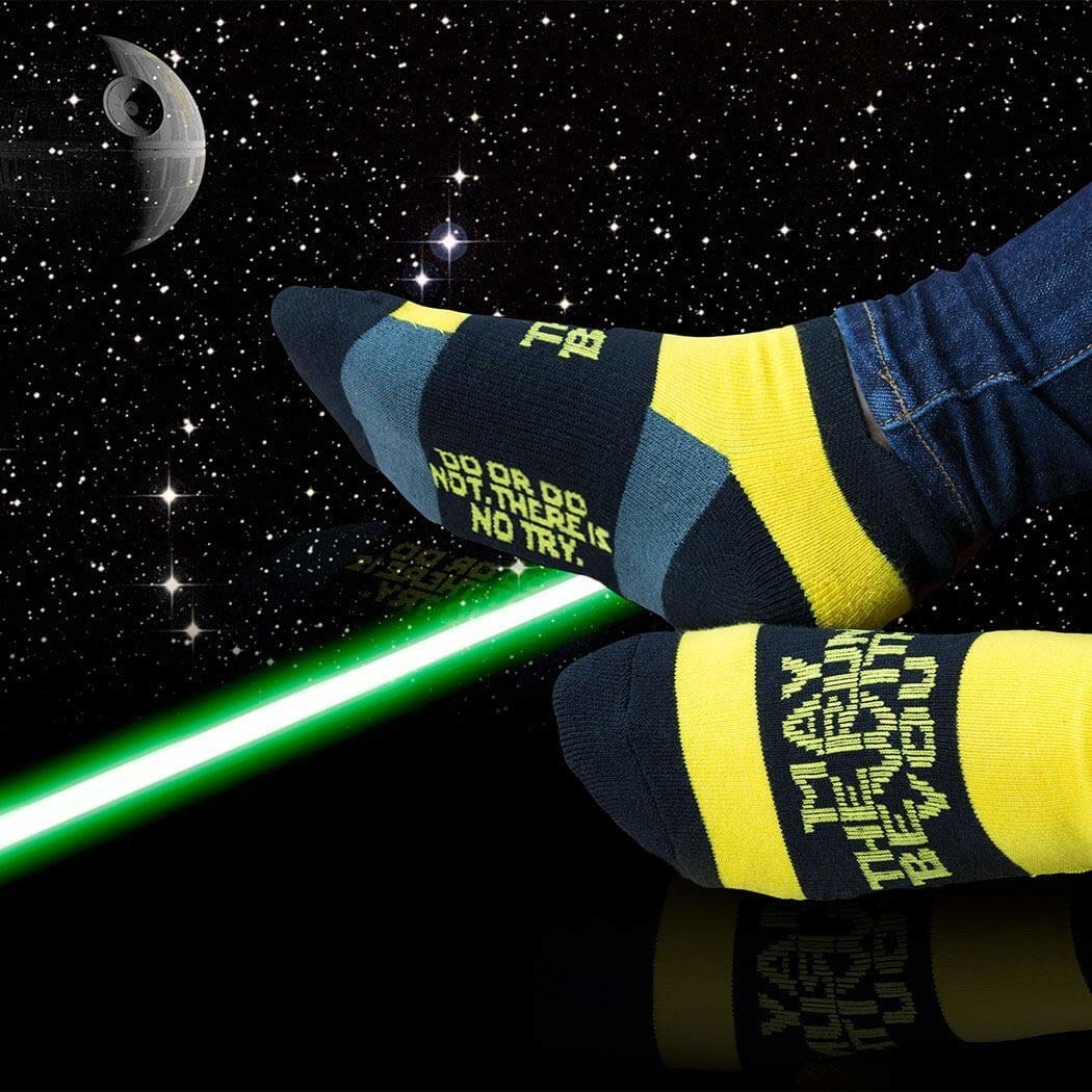 model feet wearing the &quot;May the run be with you&quot; socks against outer space background