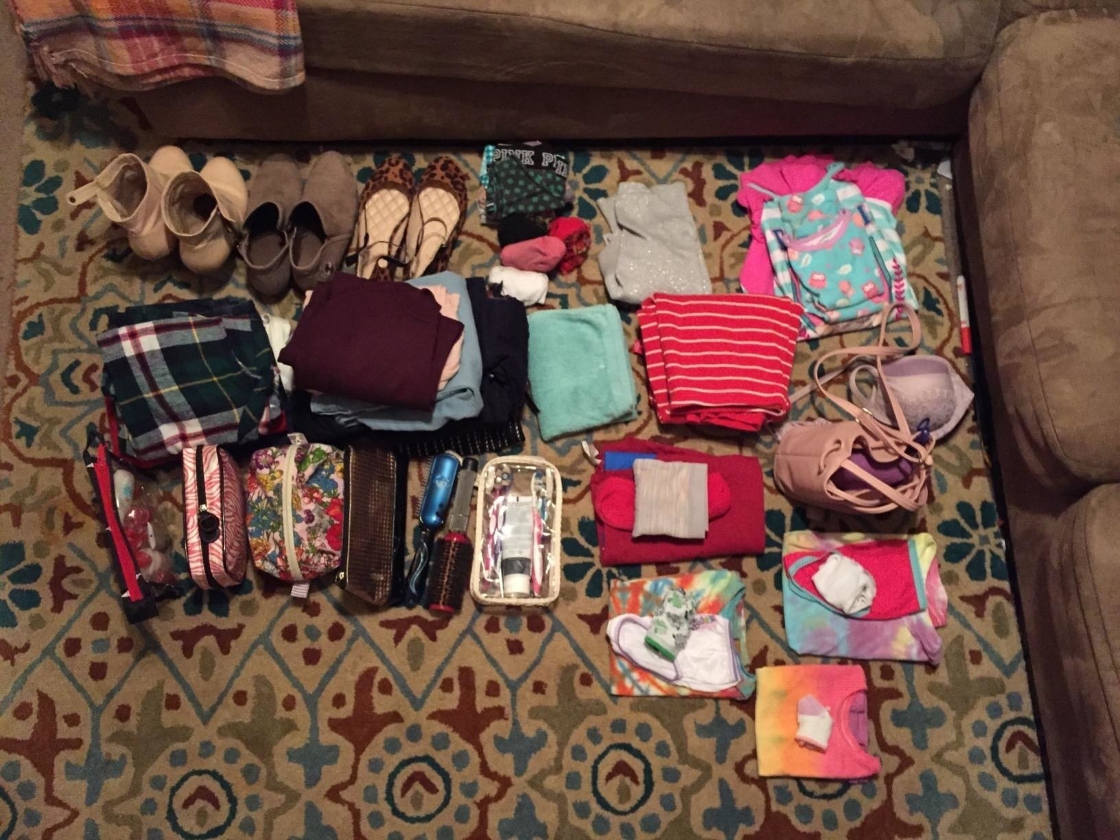 An array of clothes and shoes before packing