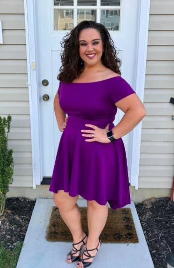 A reviewer wearing the above-the-knee dress in purple