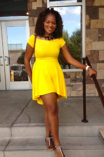 A reviewer wearing the dress in yellow