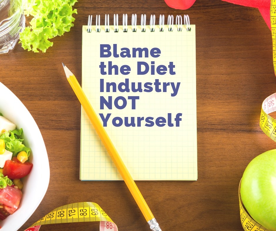 A notebook saying &quot;Blame the diet industry, not yourself.&quot;