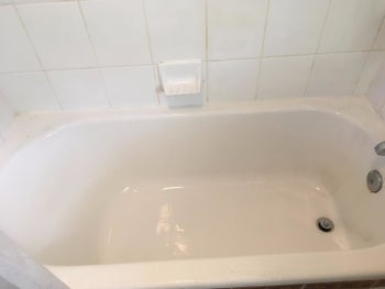 Reviewer photo of a clean tub after using the kit