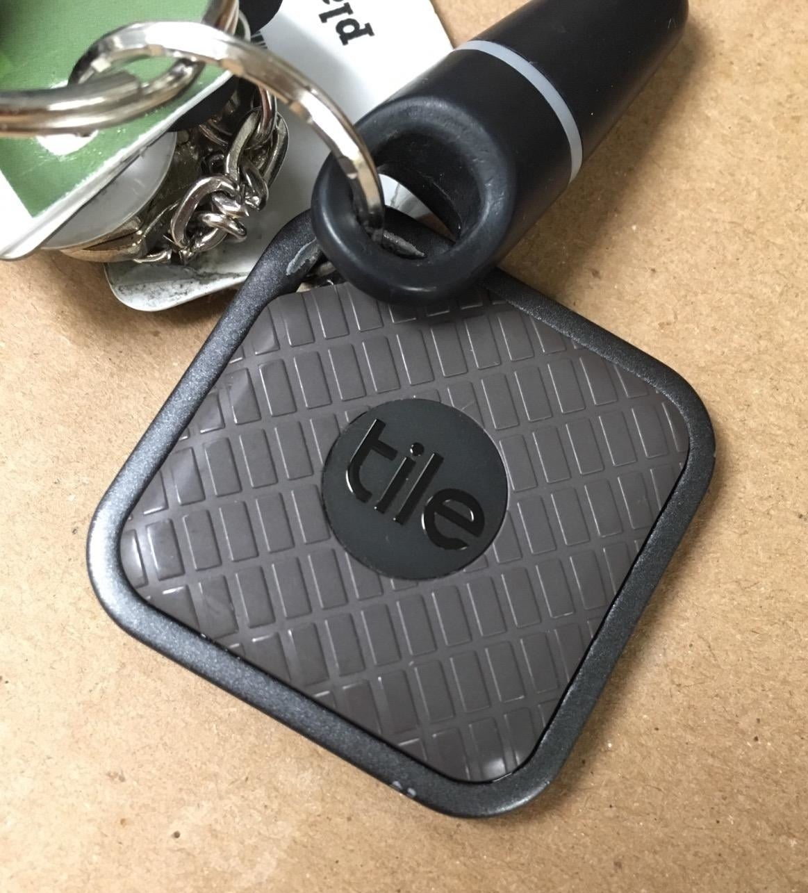 small grey tile square on reviewer&#x27;s keyring