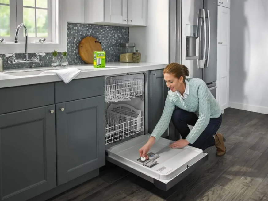 Person placing tablet in dishwasher 