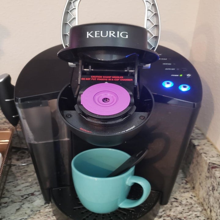 reviewer's pod placed in the Keurig