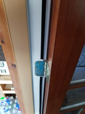 reviewer pic of the weatherstripping installed on a door