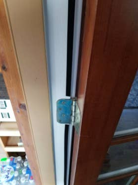 reviewer pic of the weatherstripping installed connected a door