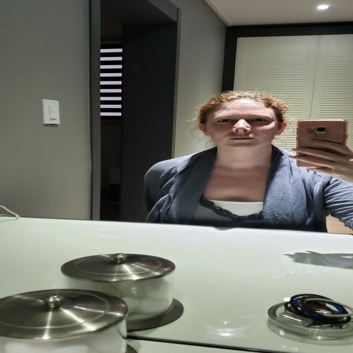 Reviewer in front of their mirror with heavy shadows on their face