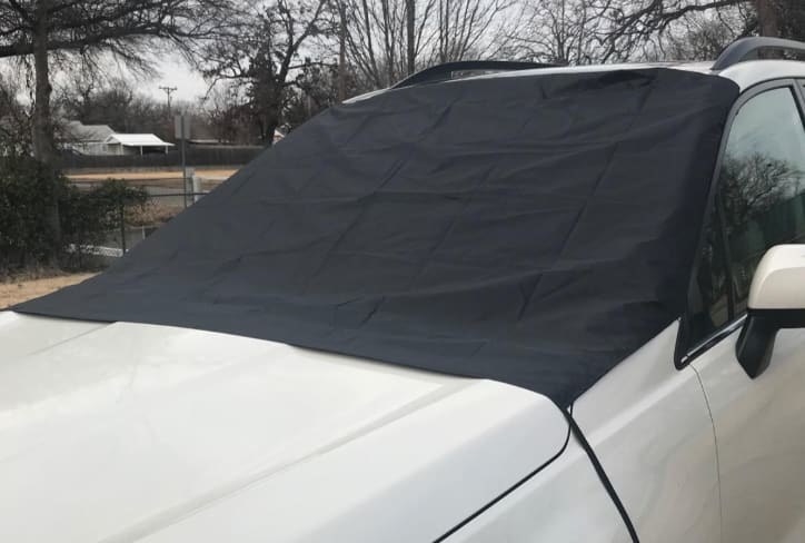 The black windshield cover over someones front car window