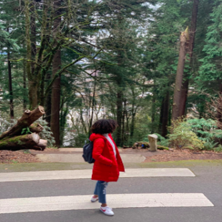 reviewer wearing the red coat