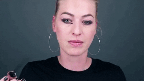 A gif of a model using the makeup remover pen to clean off an accidental eyeliner smudge