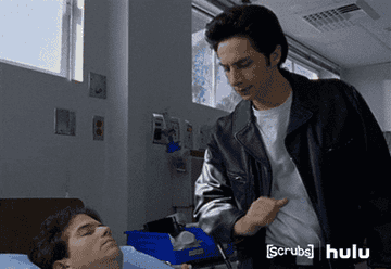 JD in Scrubs (in a fantasy) hits a patient in the arm, and the patient wakes up immediately with a smile on their face