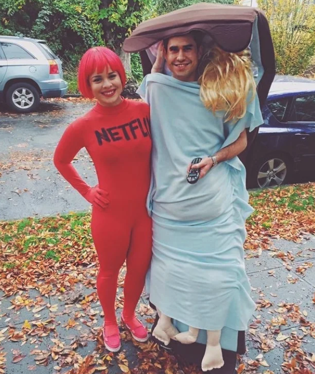 One person dressed in a red suit labeled &quot;Netflix&quot; and another dressed as a bed