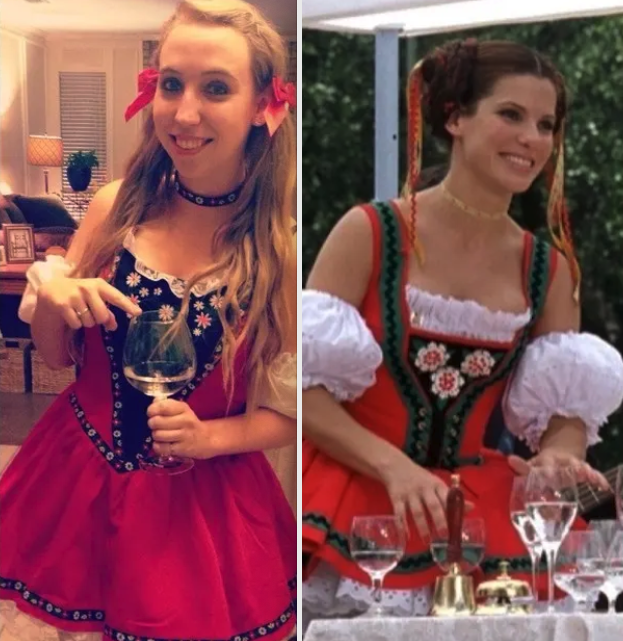 Someone in a Gracie&#x27;s German outfit while carrying filled wine glasses