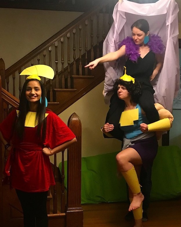 People dressed as the characters, with Kronk carrying Yzma on their shoulders