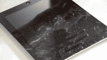 Gif of the roller wiping dust and fingerprints from a tablet screen