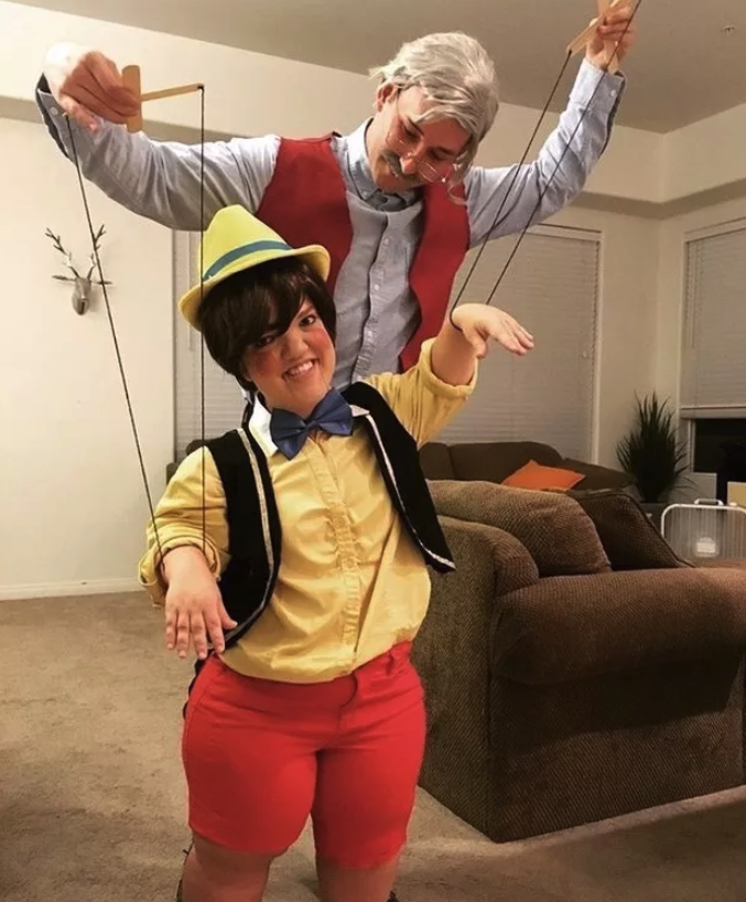 Someone dressed as Pinocchio and another as Geppetto