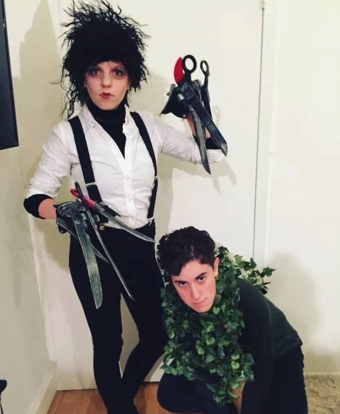 Someone dressed as Edward Scissorhands and another person dressed as a bush
