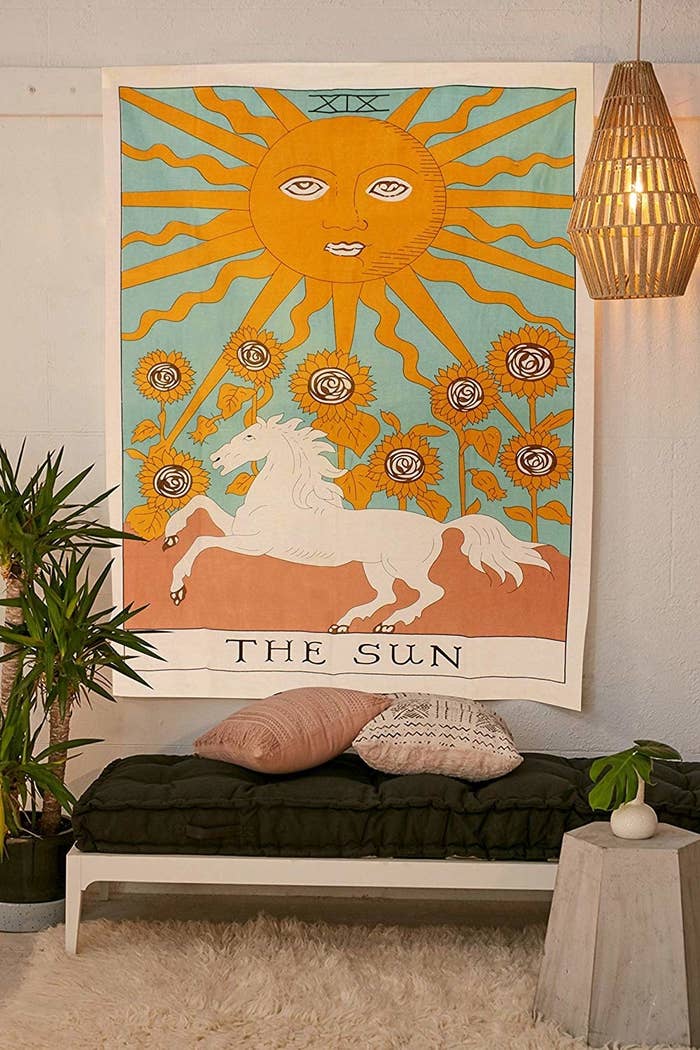 tapestry that says the sun with horse and moon and flowers 