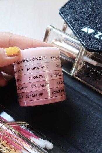 a stack of makeup essentials